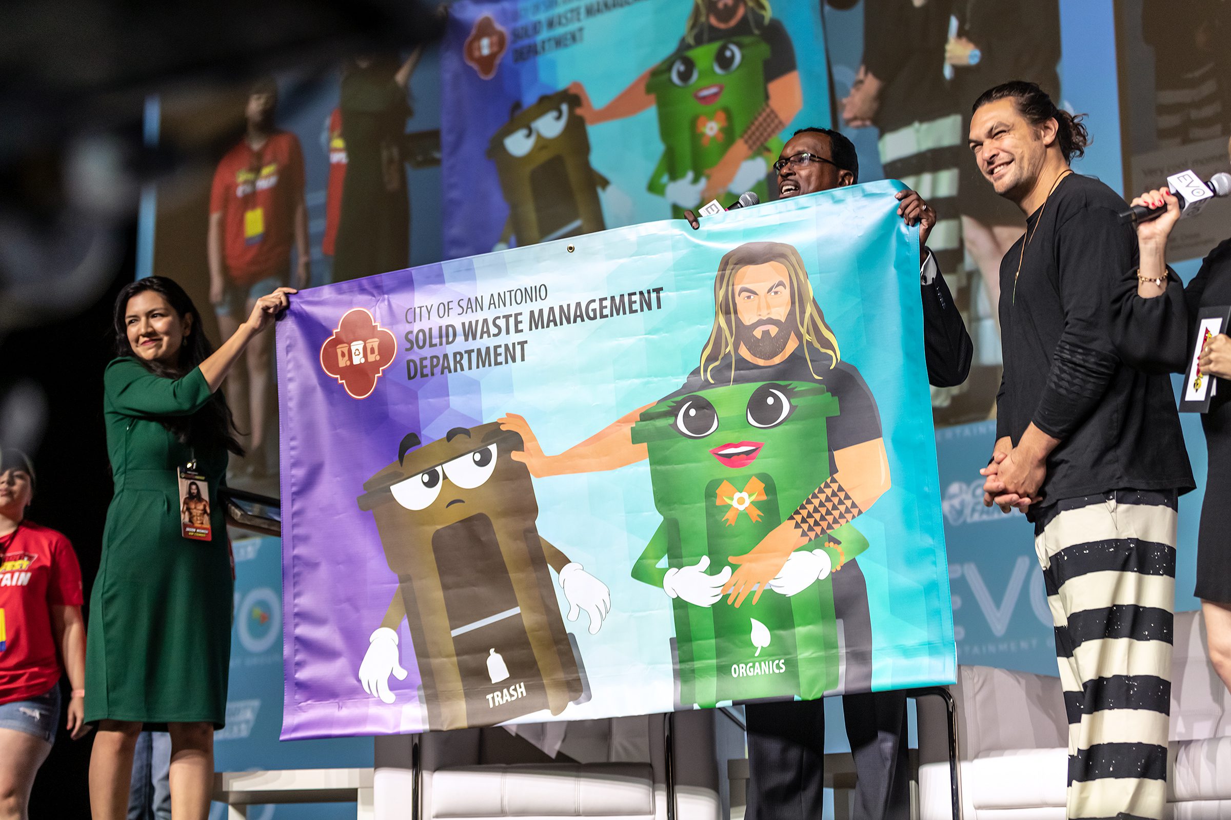 City of San Antonio Solid Waste Management banner presented toJason Momoa