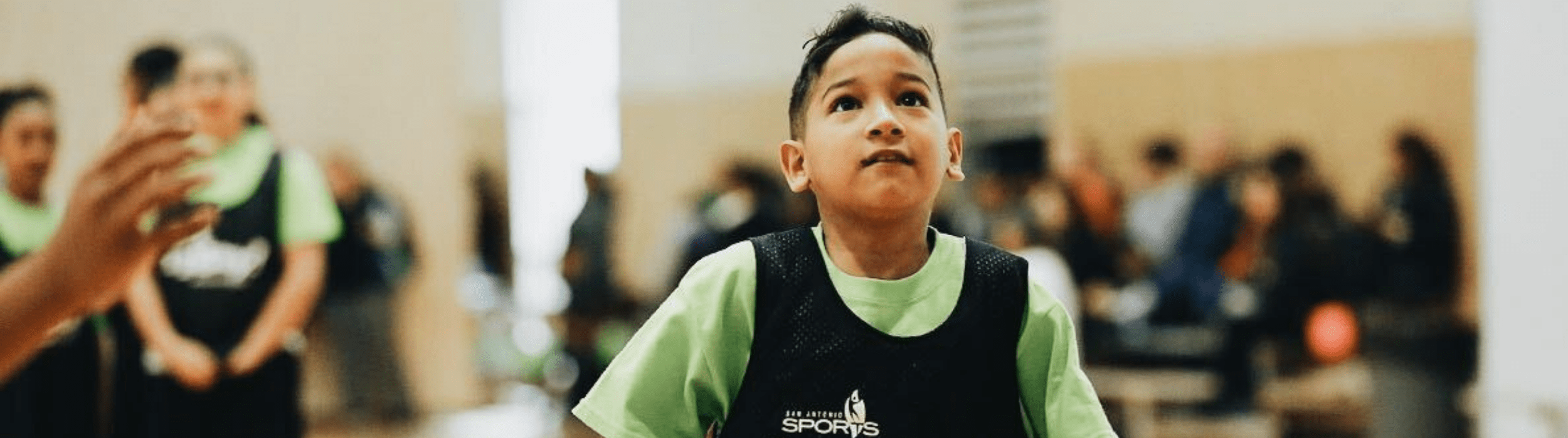 young boy with San Antonio Sports jersey